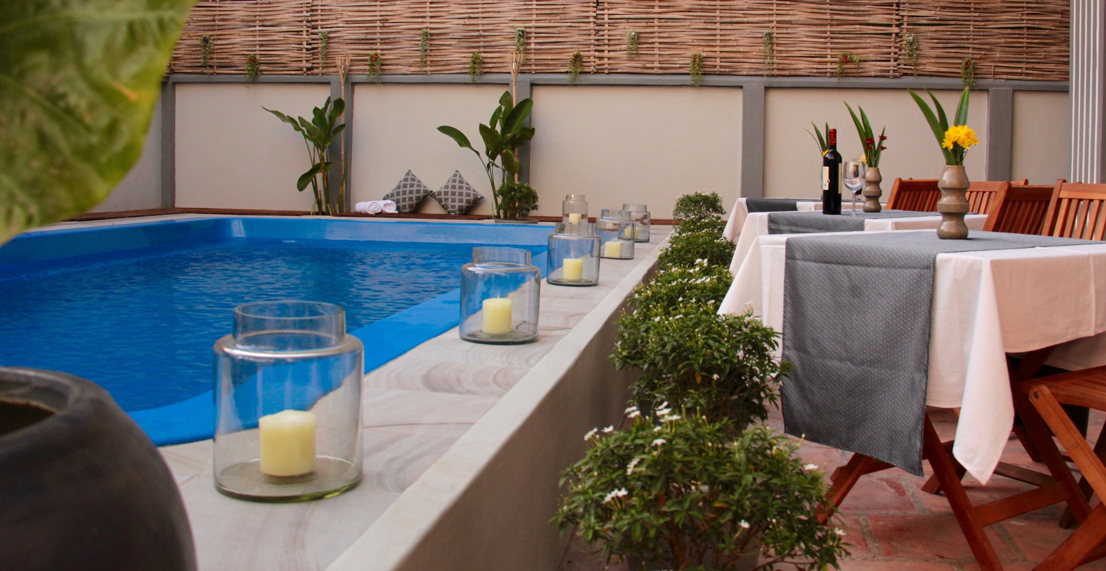 outdoor pool, pool umbrellas, pool loungers