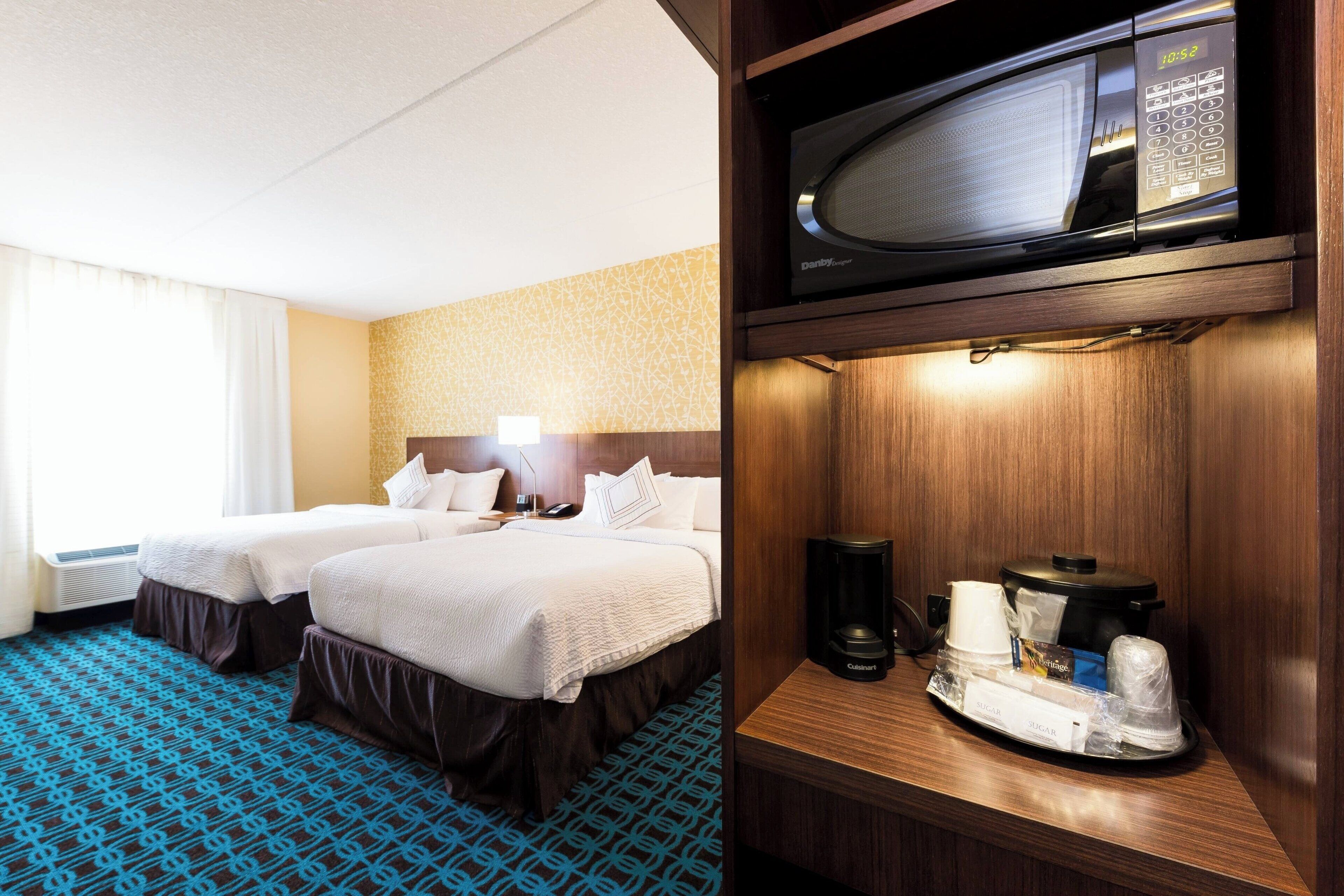 room, 2 queen beds | in-room safe, desk, iron/ironing board, free cots/infant beds