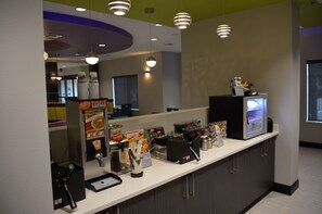 A self-service beverage station with a variety of drink options and a refrigerated display.