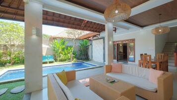 Three Bedroom Pool Villa | Living room | 30-inch LCD TV with cable channels, TV