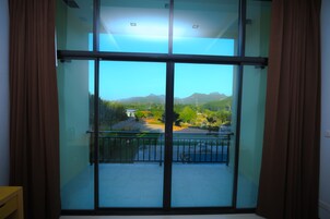 Superior Quadruple Room | In-room safe, individually decorated, desk, laptop workspace