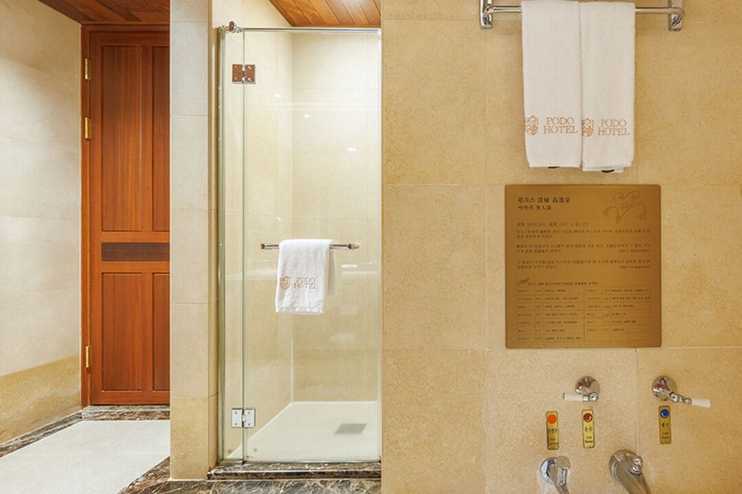 separate bathtub and shower, designer toiletries, hair dryer, bathrobes