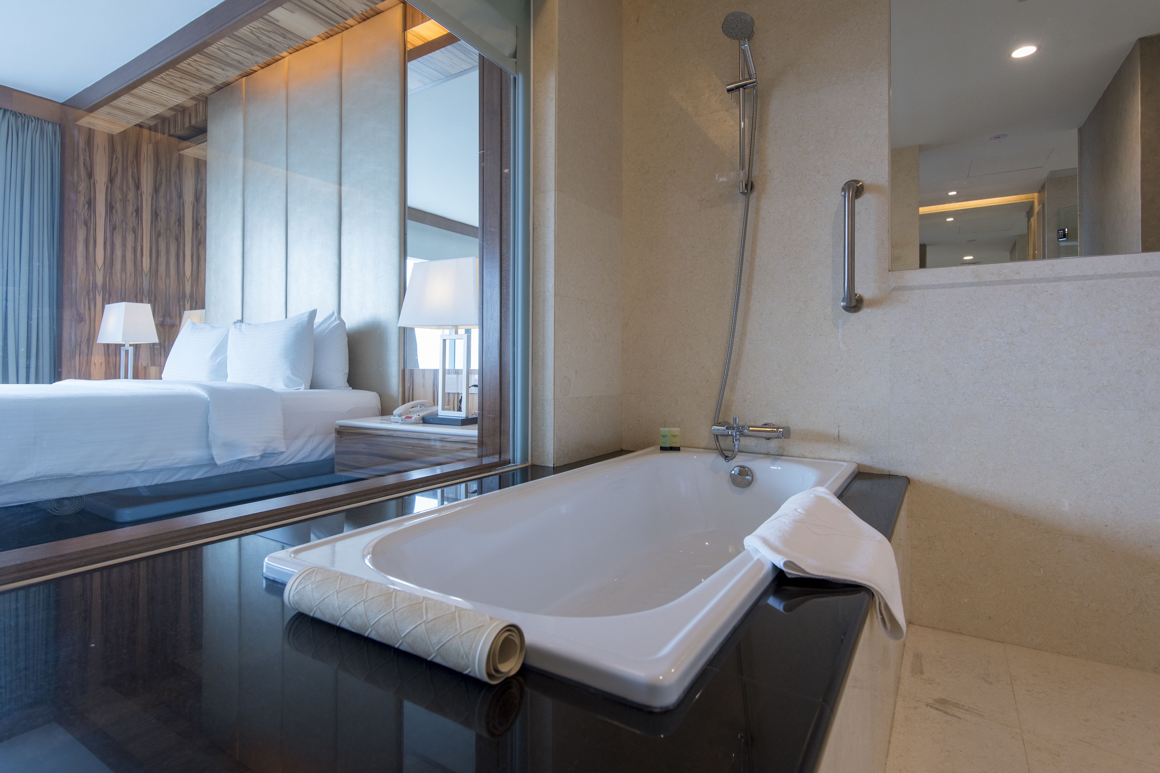 premium suite, 1 king bed, bathtub | bathroom | shower, free toiletries, hair dryer, slippers