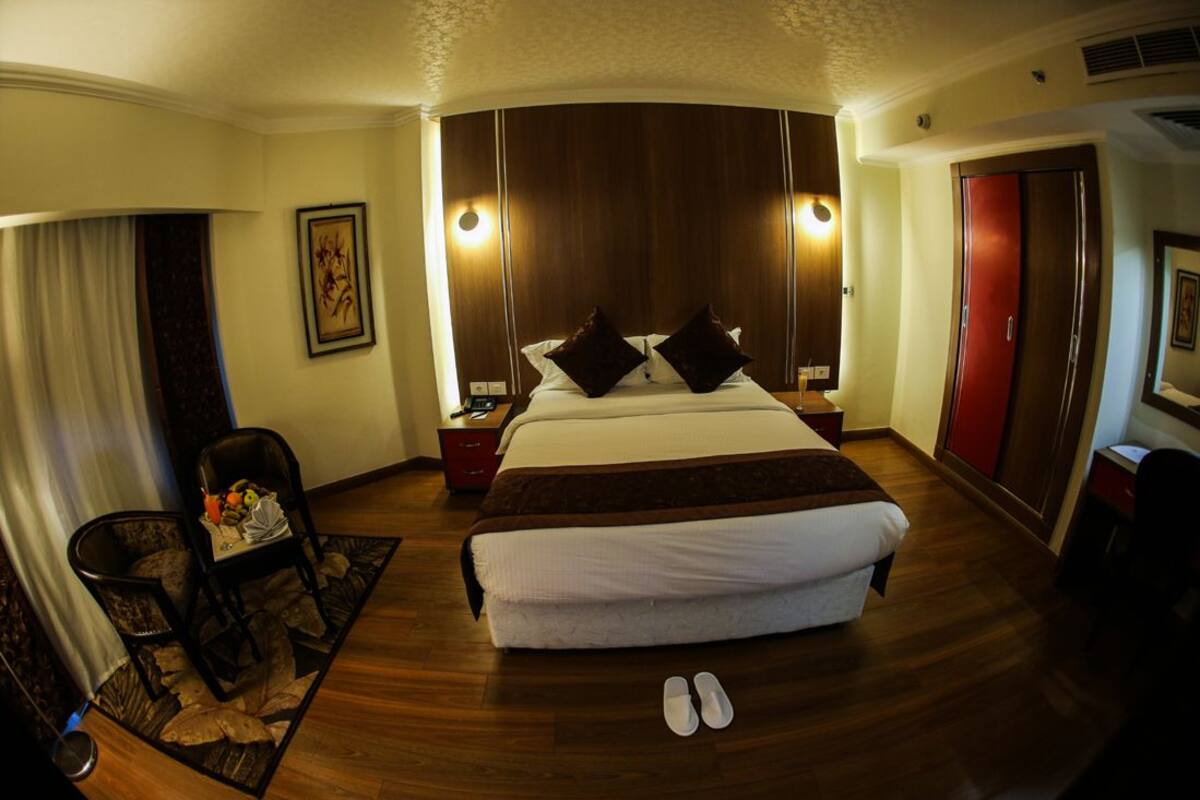 Junior Suite, 1 Bedroom, Garden View | Living room | Flat-screen TV