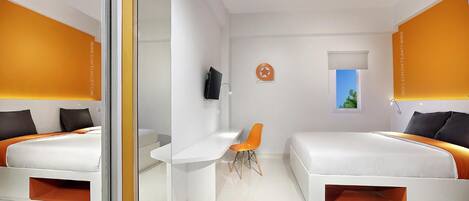 A modern hotel room with two beds, a desk, and a chair.