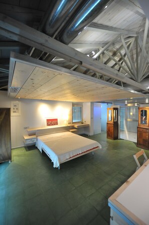 A room with a bed, a desk, and a cabinet. - The architect's house (Apokoronas)