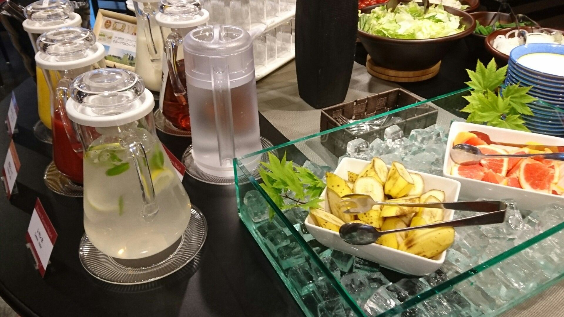 A buffet with various food items and beverages.
