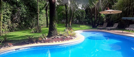 Outdoor pool, open 8:00 AM to 8:00 PM, pool loungers