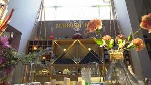 A room with a sign reading "Turkish Bath" and a shelf with various items. - Exelsior Annex (Marmaris)