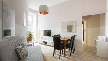 Apartment (Wedding 9) | Living area | 42-inch flat-screen TV with cable channels, TV, DVD player