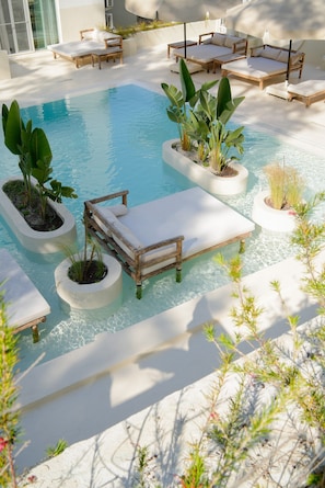 Seasonal outdoor pool, pool umbrellas, pool loungers