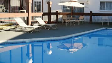 Seasonal outdoor pool, pool loungers