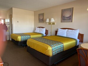 A hotel room with two beds, a desk, and a chair. - Parkview Motel (Corning)