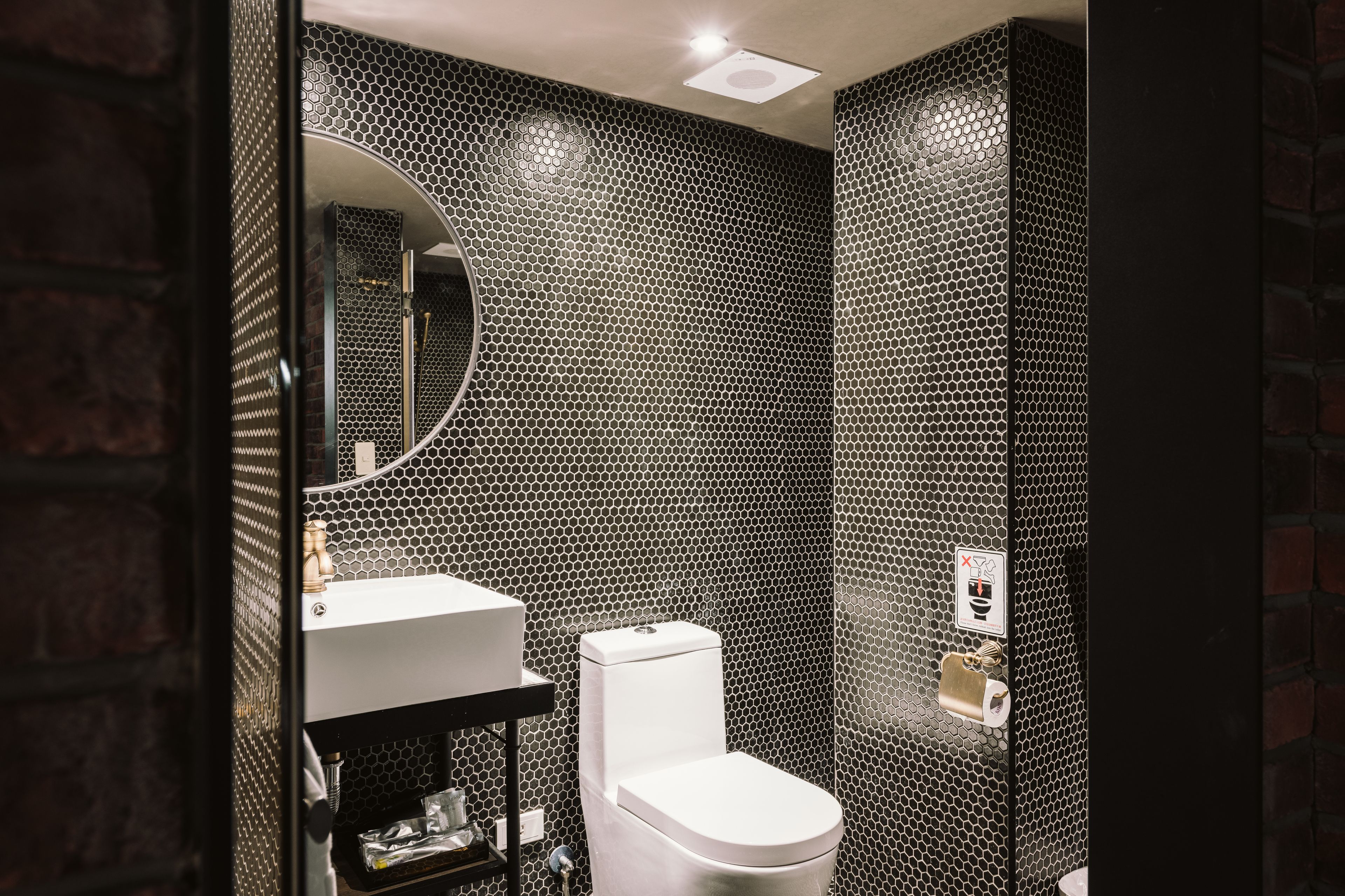 deluxe family room | bathroom | shower, hair dryer, slippers, towels