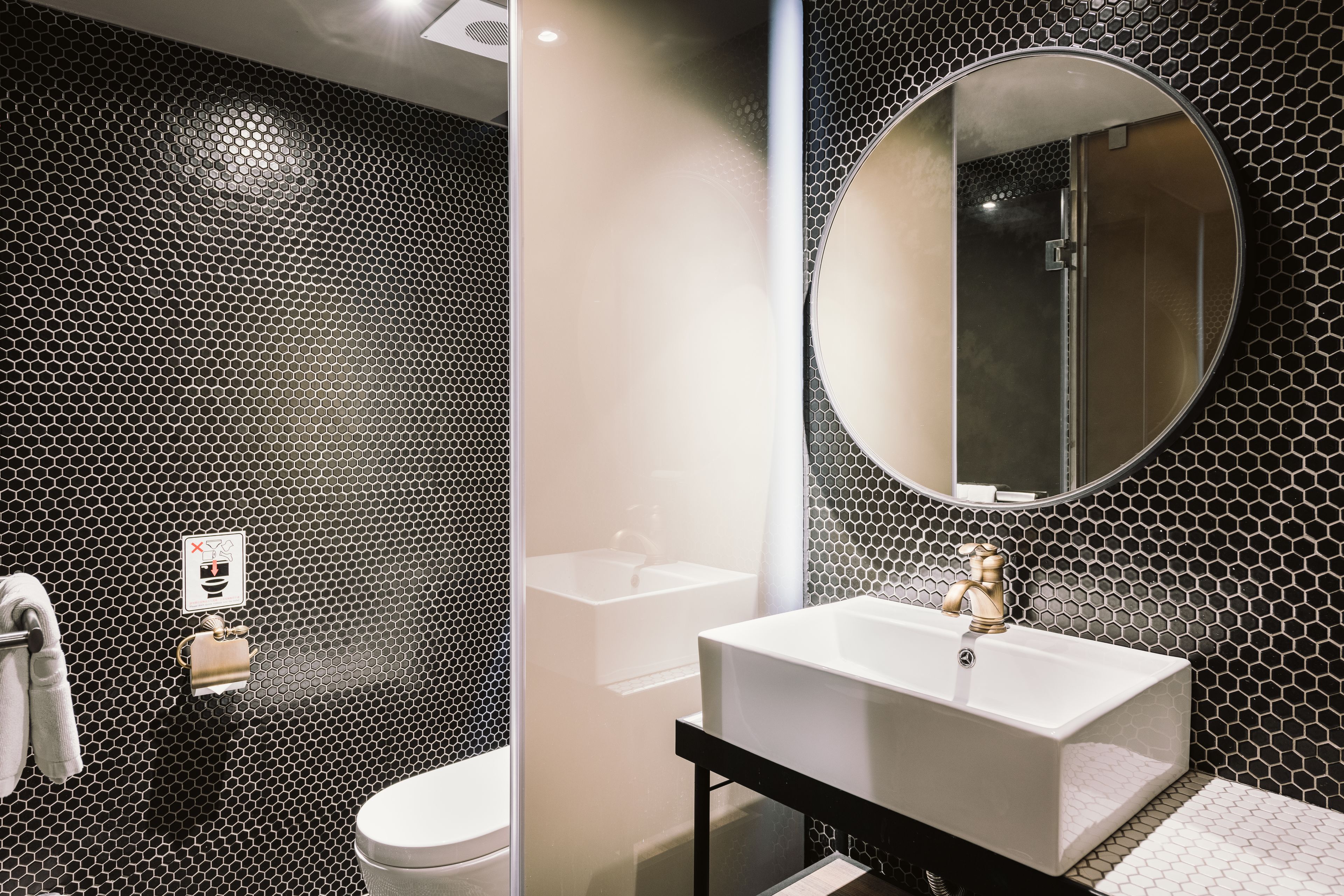 shower, hair dryer, slippers, towels