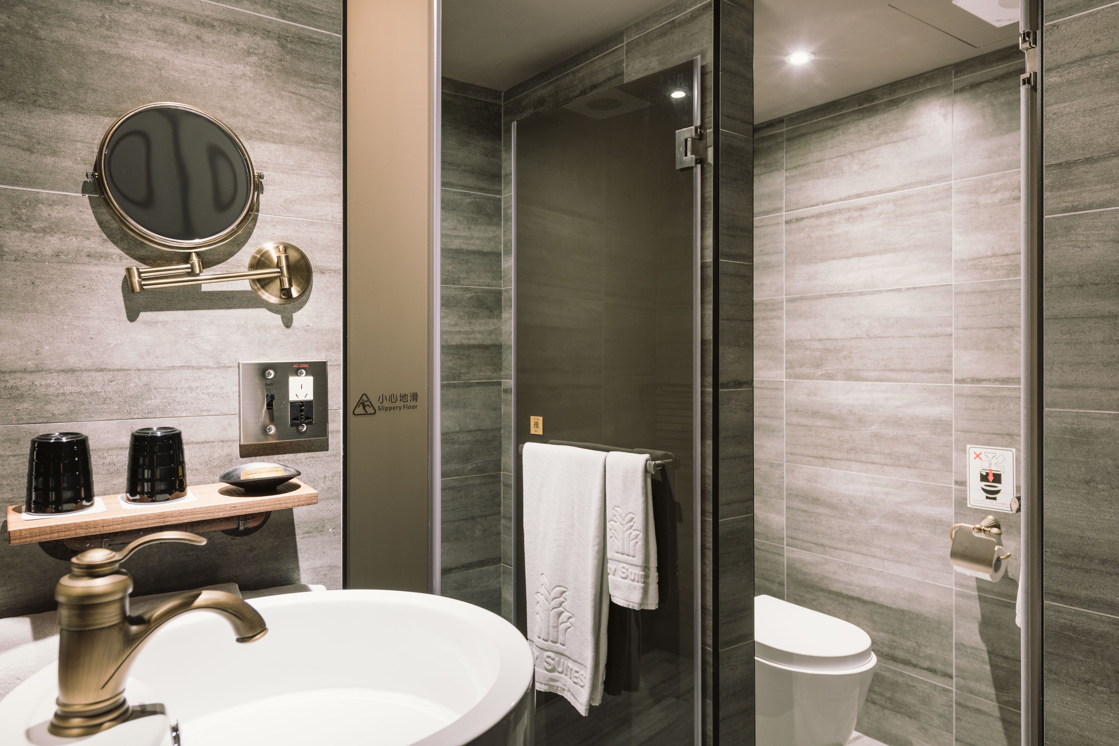 shower, hair dryer, slippers, towels