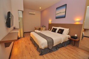 Executive-huone | Pimennysverhot, silitysrauta/-lauta, ilmainen Wi-Fi, vuodevaatteet