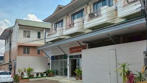 A building with a storefront labeled 'Hotel Lotos.' - Nornnan Hotel (Nan)