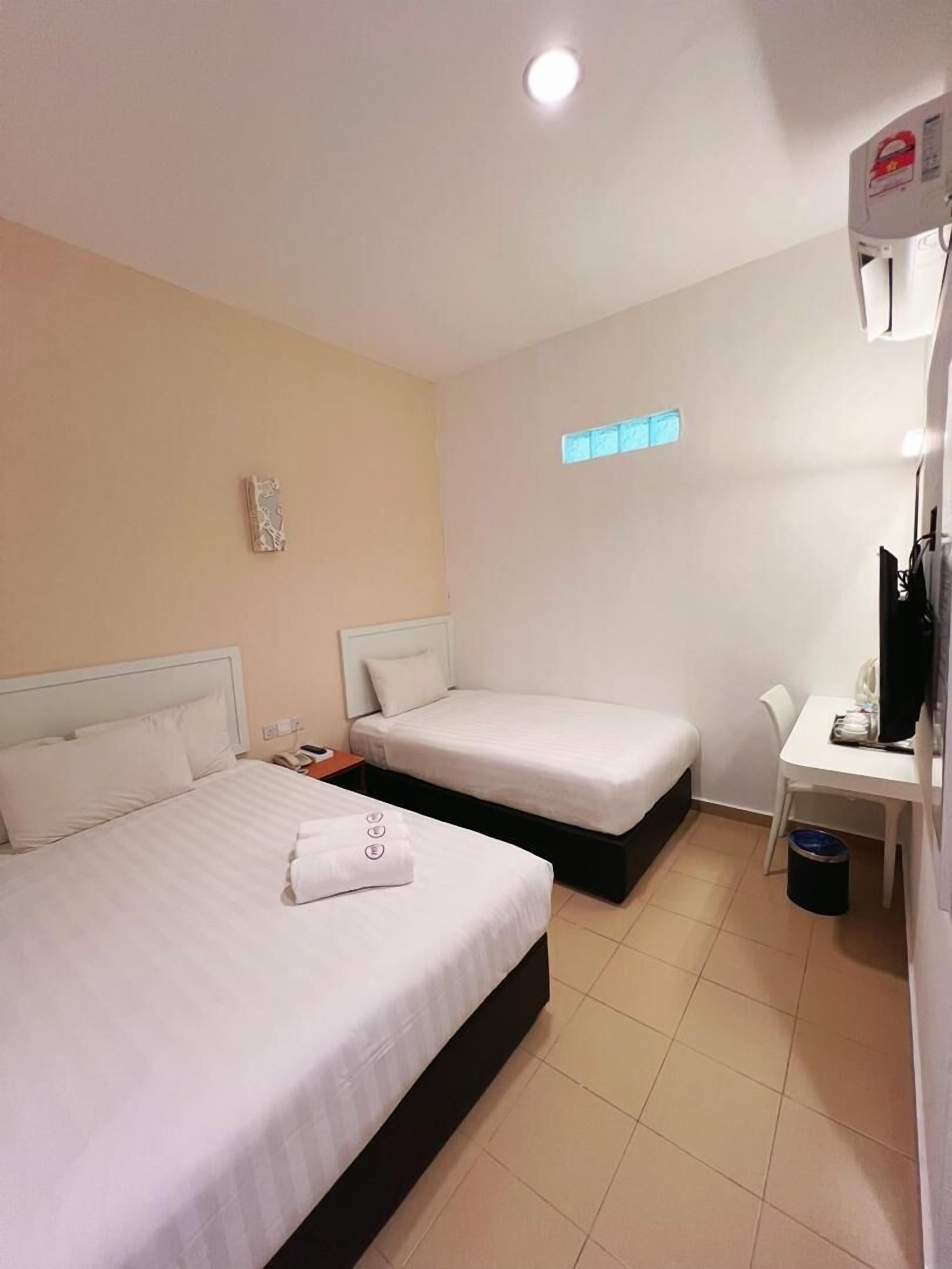 Triple Room, No Windows | Desk, blackout curtains, iron/ironing board, free WiFi