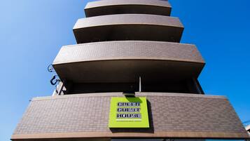 Experience the unique architecture of the Green Guest House, featuring accessible balconies and a distinctive design.