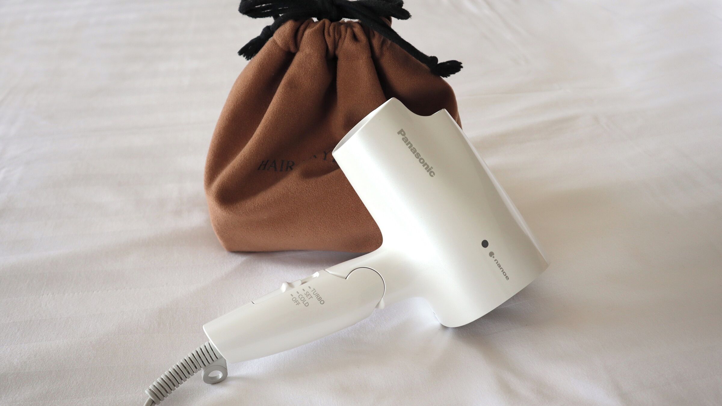 combined shower/bathtub, free toiletries, hair dryer, slippers