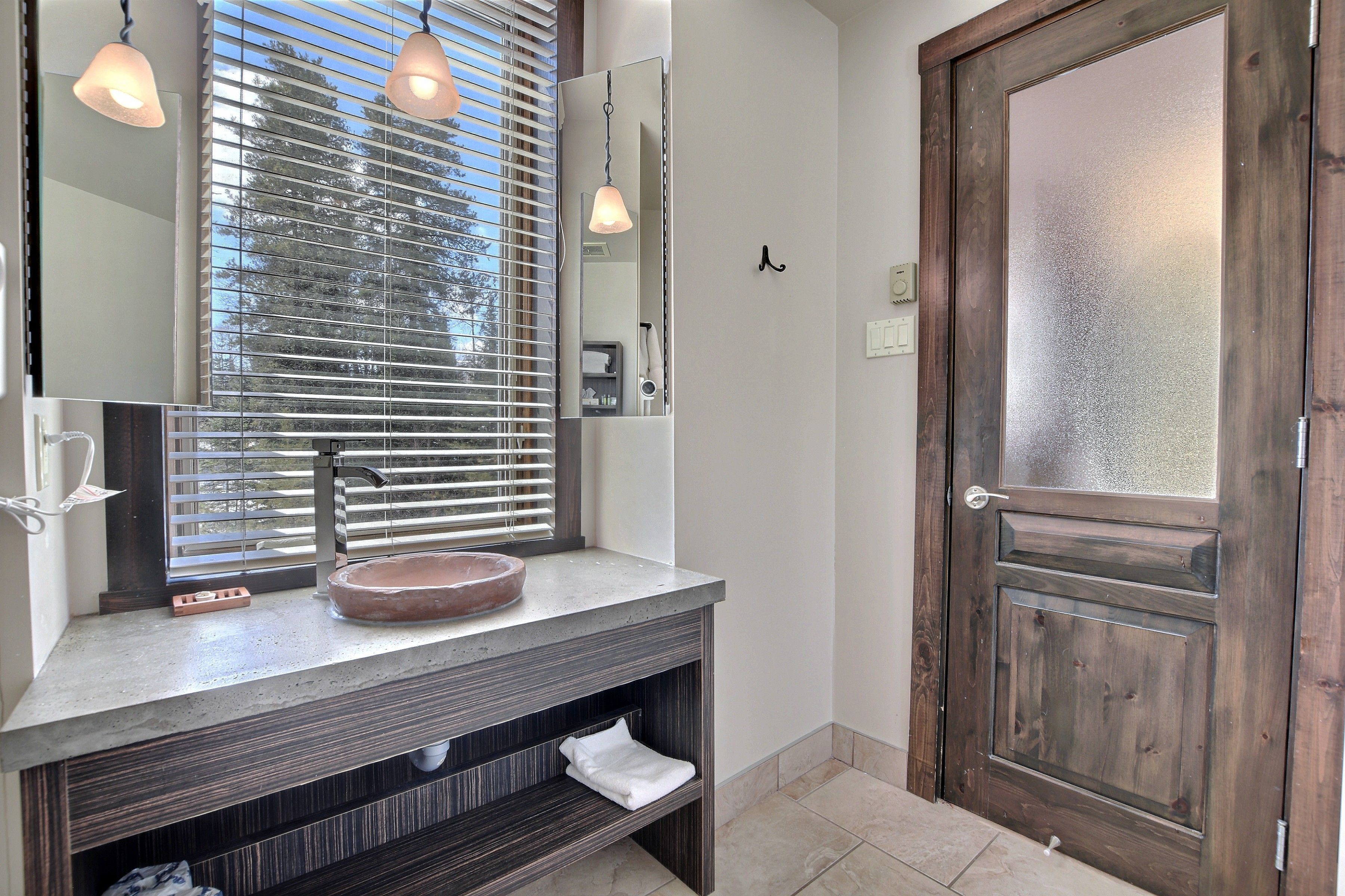 royal condo | bathroom | designer toiletries, hair dryer, towels