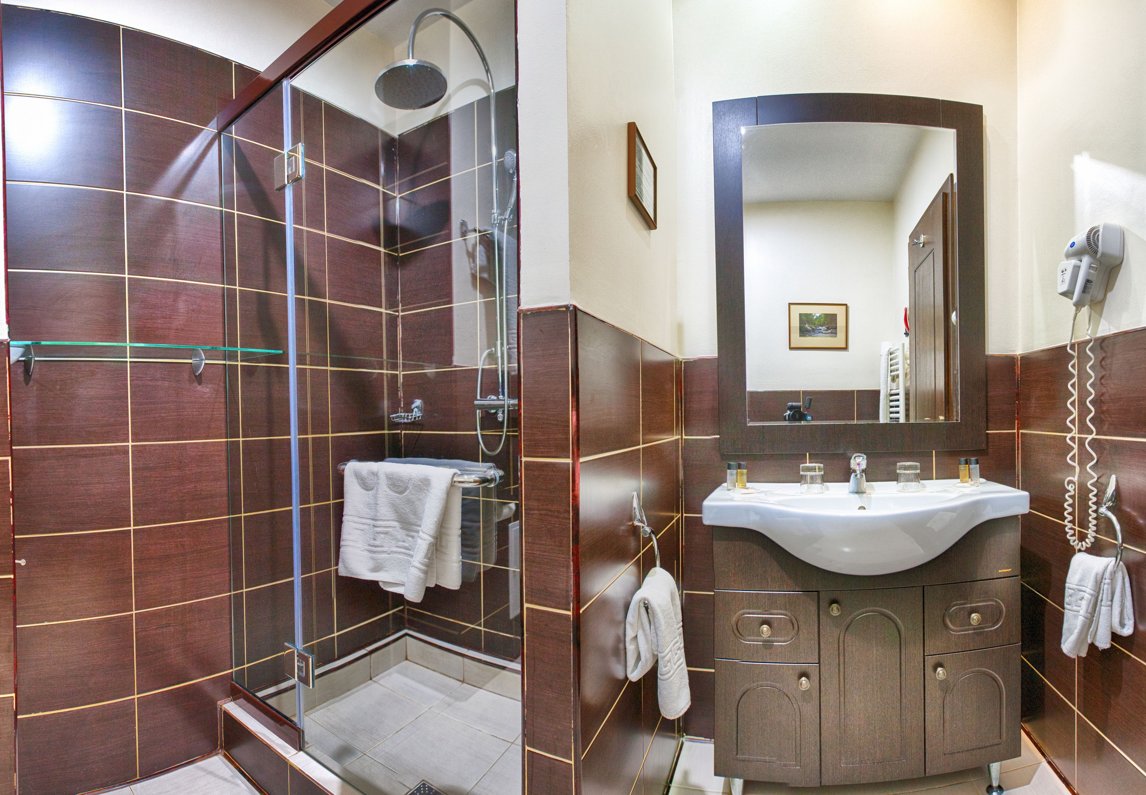 combined shower/bathtub, jetted bath, free toiletries, dressing gowns