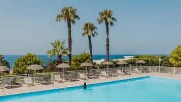 Seasonal outdoor pool, pool umbrellas, pool loungers