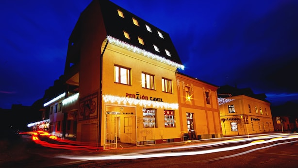 A building with a sign reading "Pension Cavel" and a visible entrance. - Tavel Boutique Hotel (Prešov)