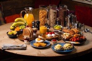 A breakfast buffet with various food items and beverages. - The Running Horse (Winchester)