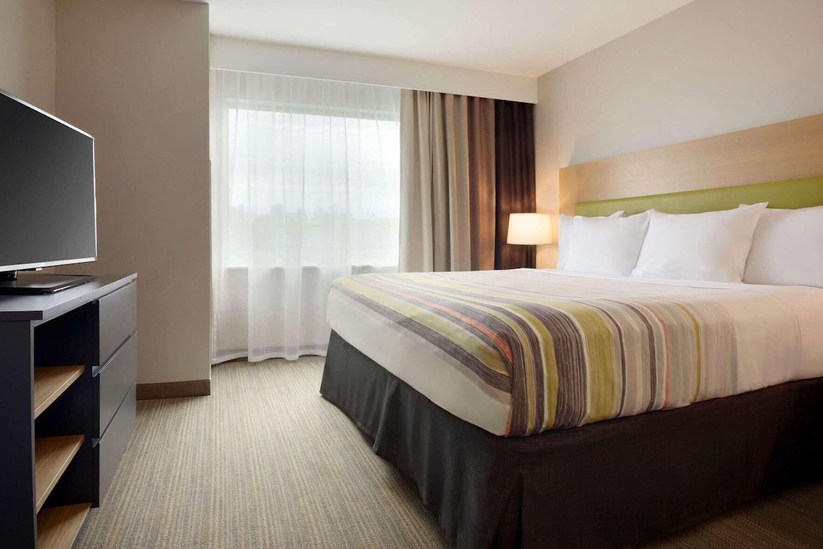 Down comforters, desk, blackout drapes, iron/ironing board