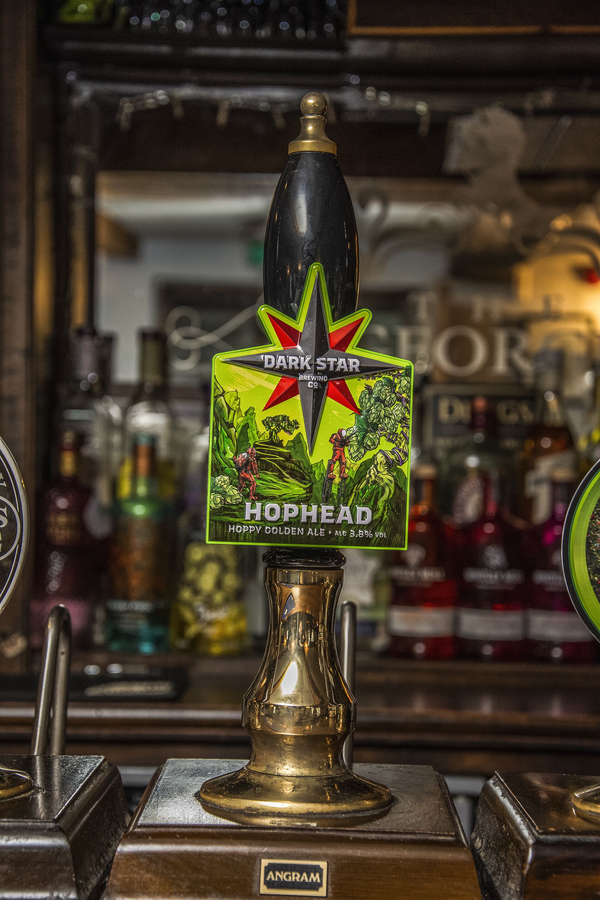 A tap labeled "Dark Star Hophead" with a label featuring a mountain scene.