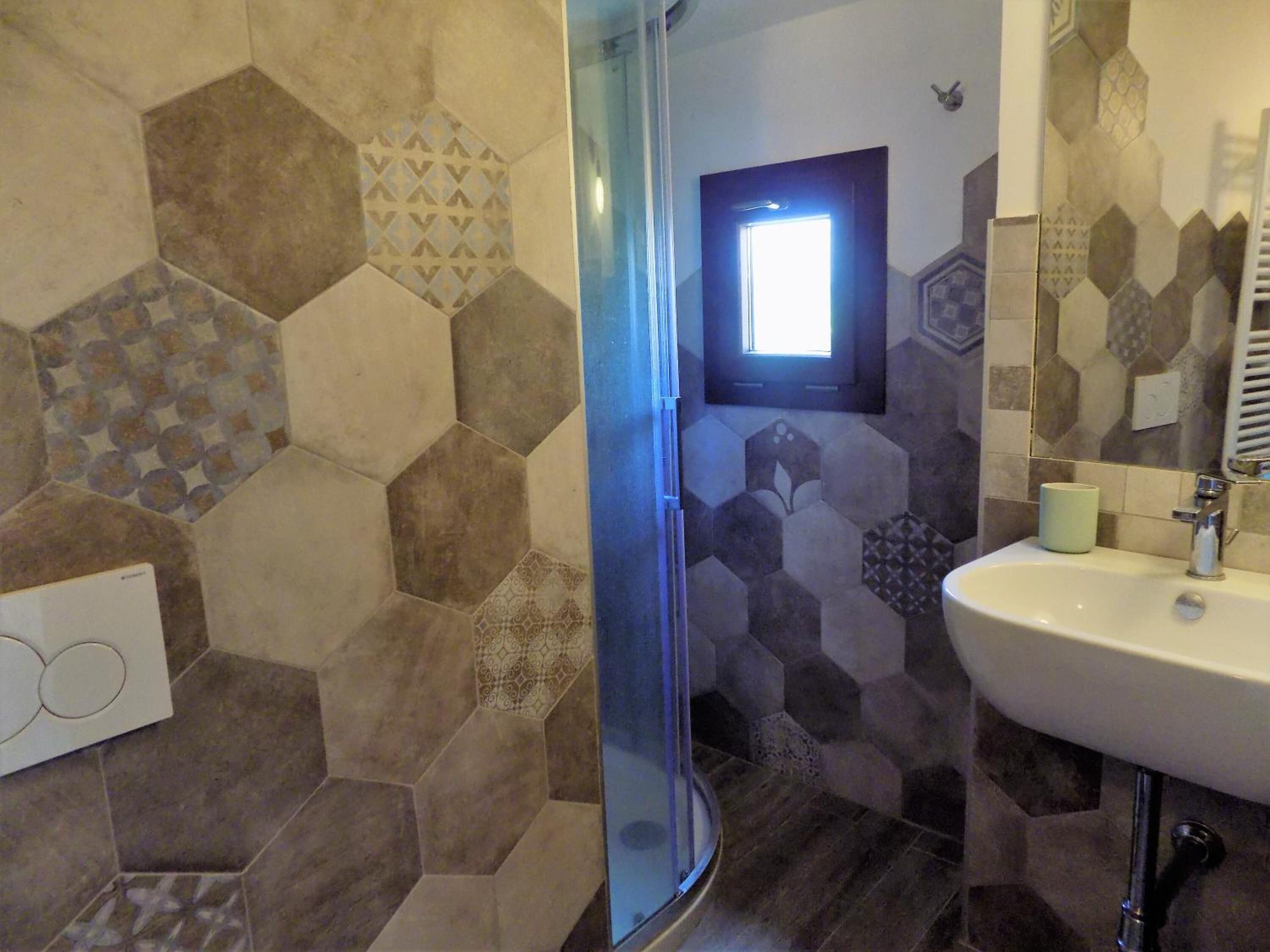 Shower, free toiletries, hair dryer, bathrobes