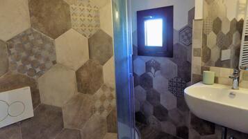 Shower, free toiletries, hair dryer, bathrobes