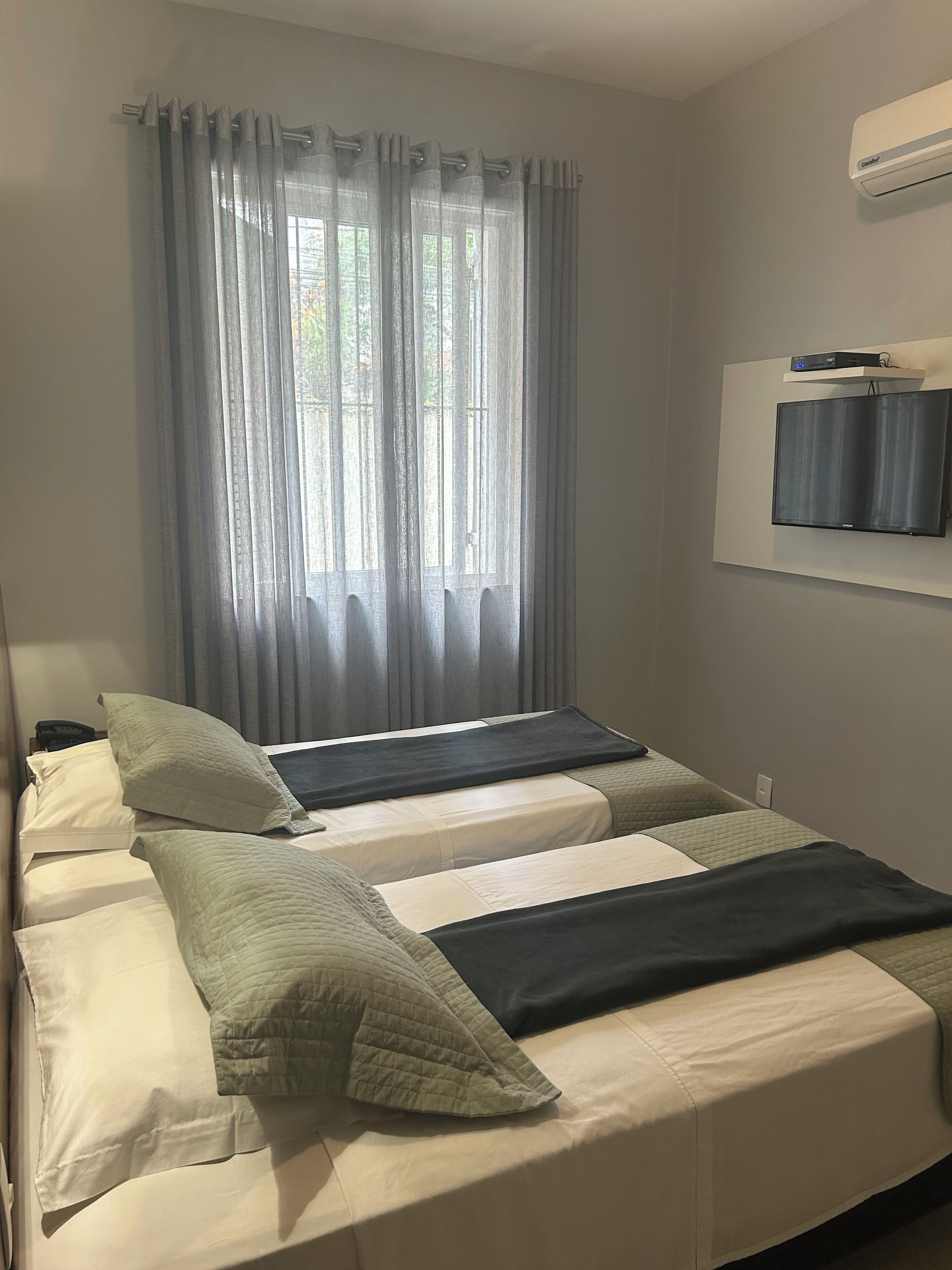 standard twin room, 2 single beds | minibar, individually decorated, desk, blackout curtains