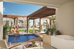 A pool area with a wooden deck, a jacuzzi, and a view of the pool. - Dreams Onyx Resort & Spa All Inclusive (Punta Cana)