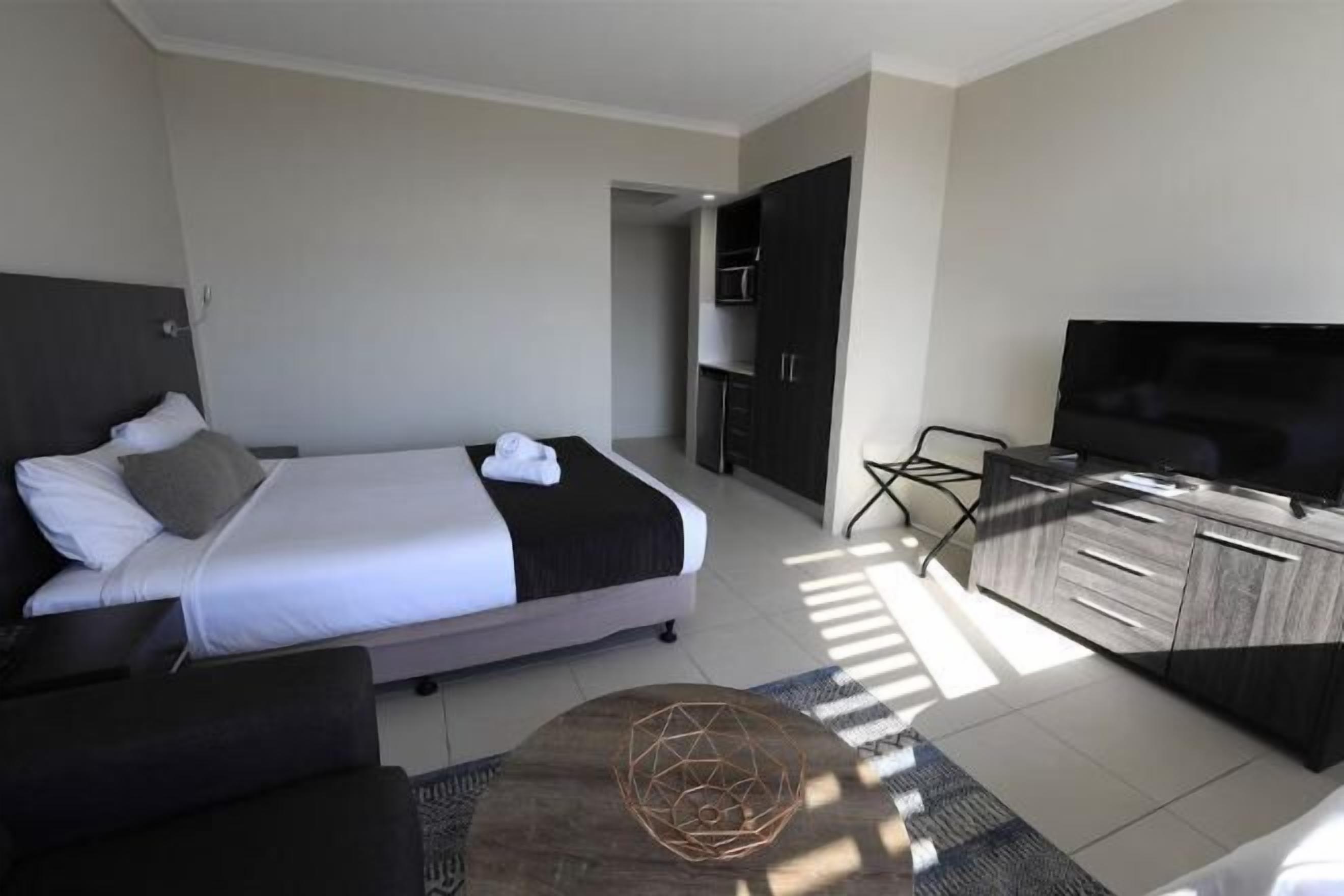 Premium bedding, blackout drapes, soundproofing, iron/ironing board