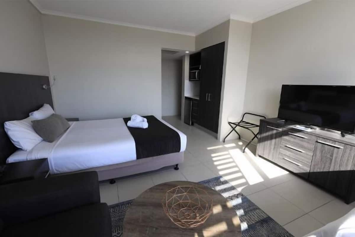 Premium bedding, blackout drapes, soundproofing, iron/ironing board