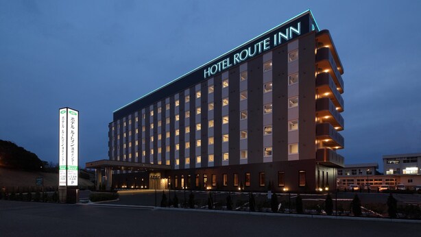 A multi-story hotel with a prominent sign reading "HOTEL ROUTE INN". - Hotel Route-Inn Shimizu Inter (Shizuoka)
