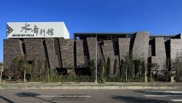 Shuei Wu Villa features a distinctive, angular design with a well-manicured lawn.