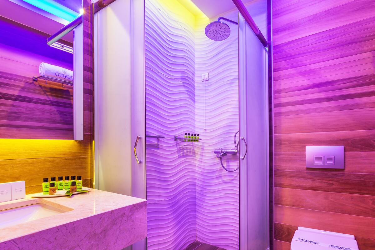 combined shower/bathtub, designer toiletries, hair dryer, bathrobes