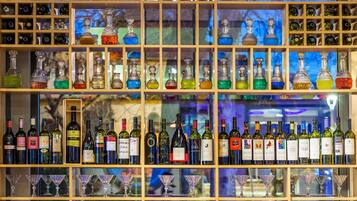 A wine and glass display with various bottles and glasses.