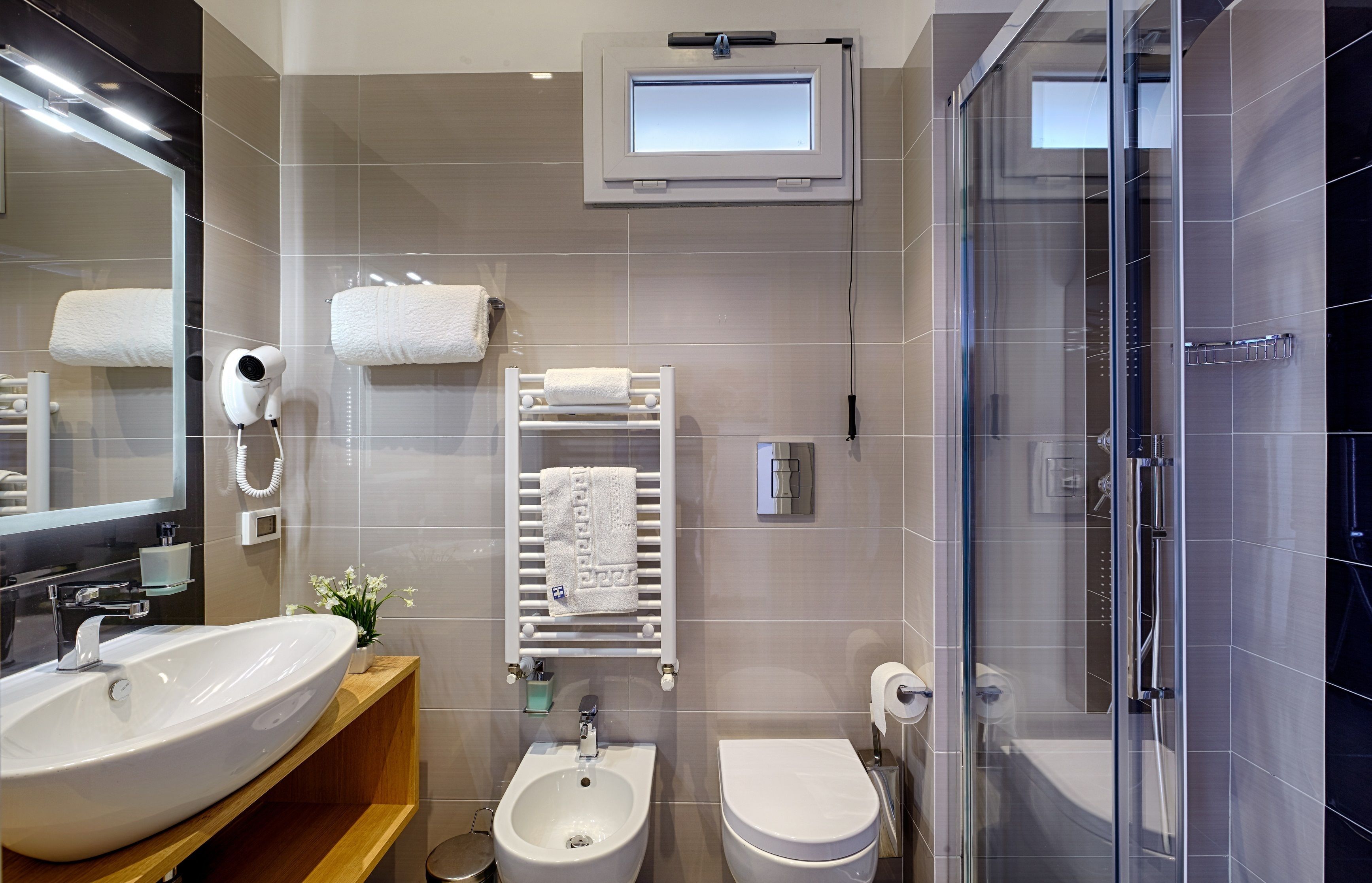 shower, hair dryer, bidet, towels