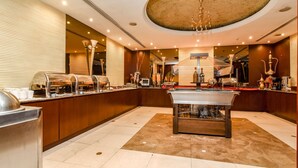 A spacious lobby with a pool table, a buffet area, and a bar. - Landmark Summit Hotel (Dubai)