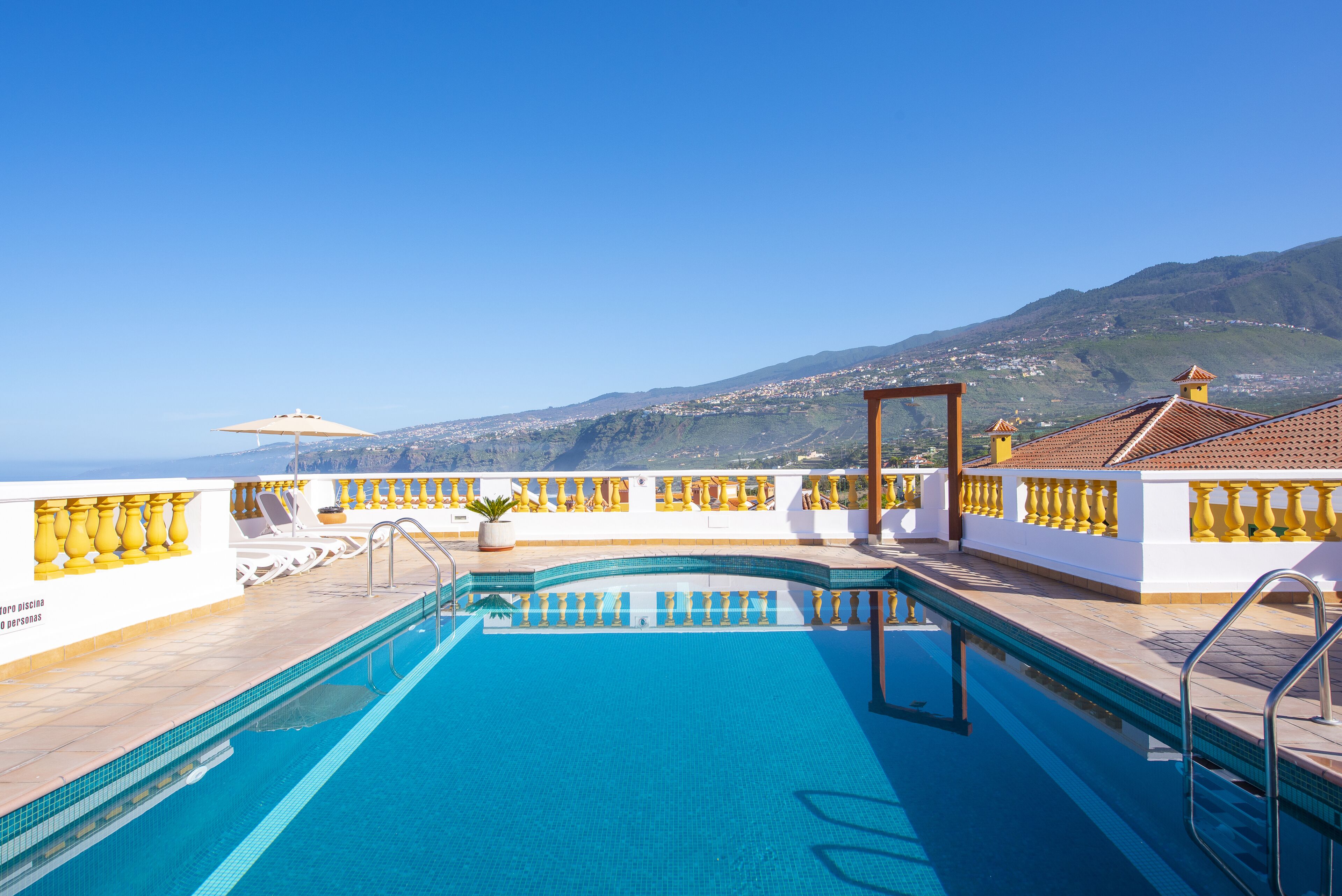 Outdoor pool, a heated pool, pool umbrellas, sun loungers