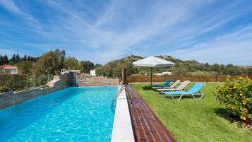 Outdoor pool, pool umbrellas, sun loungers