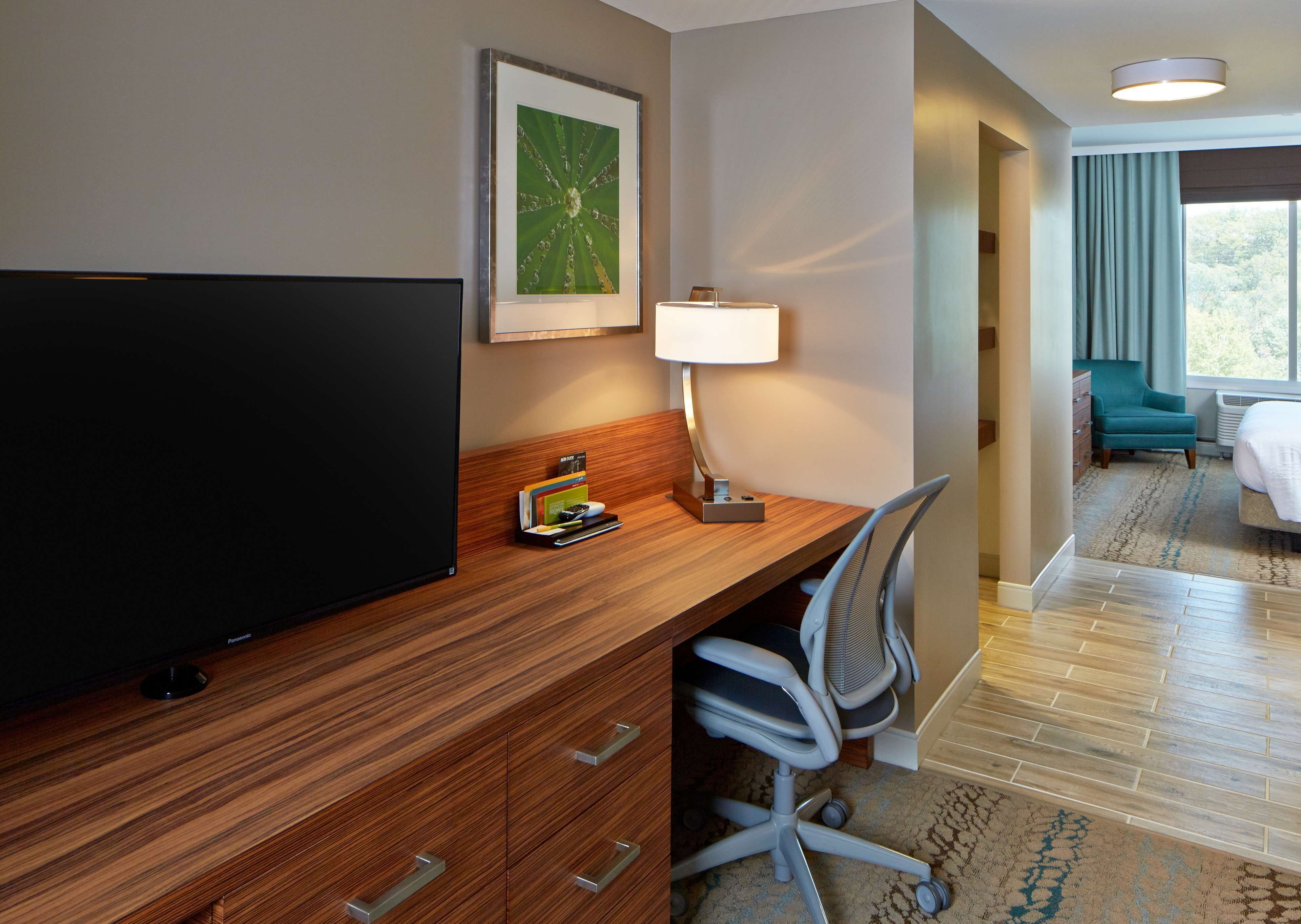 desk, laptop workspace, blackout curtains, iron/ironing board