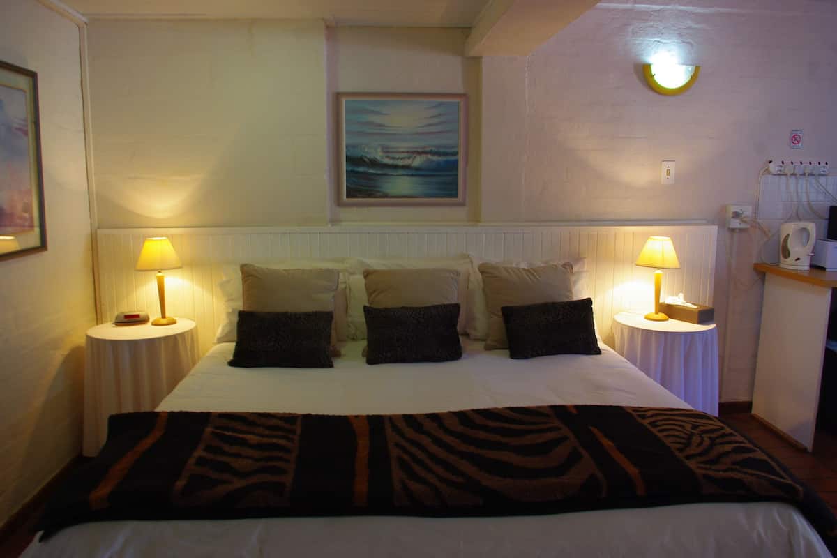 Family Suite, 2 Bedrooms, Kitchenette, Ground Floor | Desk, laptop workspace, iron/ironing board, free WiFi