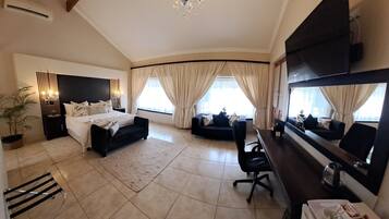 Deluxe Double Room, 1 King Bed | 1 bedroom, in-room safe, individually decorated, desk