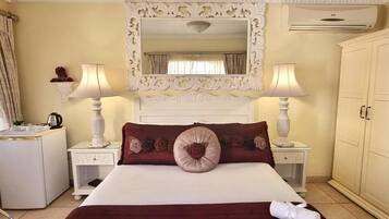 Superior Room, 1 King Bed, Poolside | 1 bedroom, in-room safe, individually decorated, desk